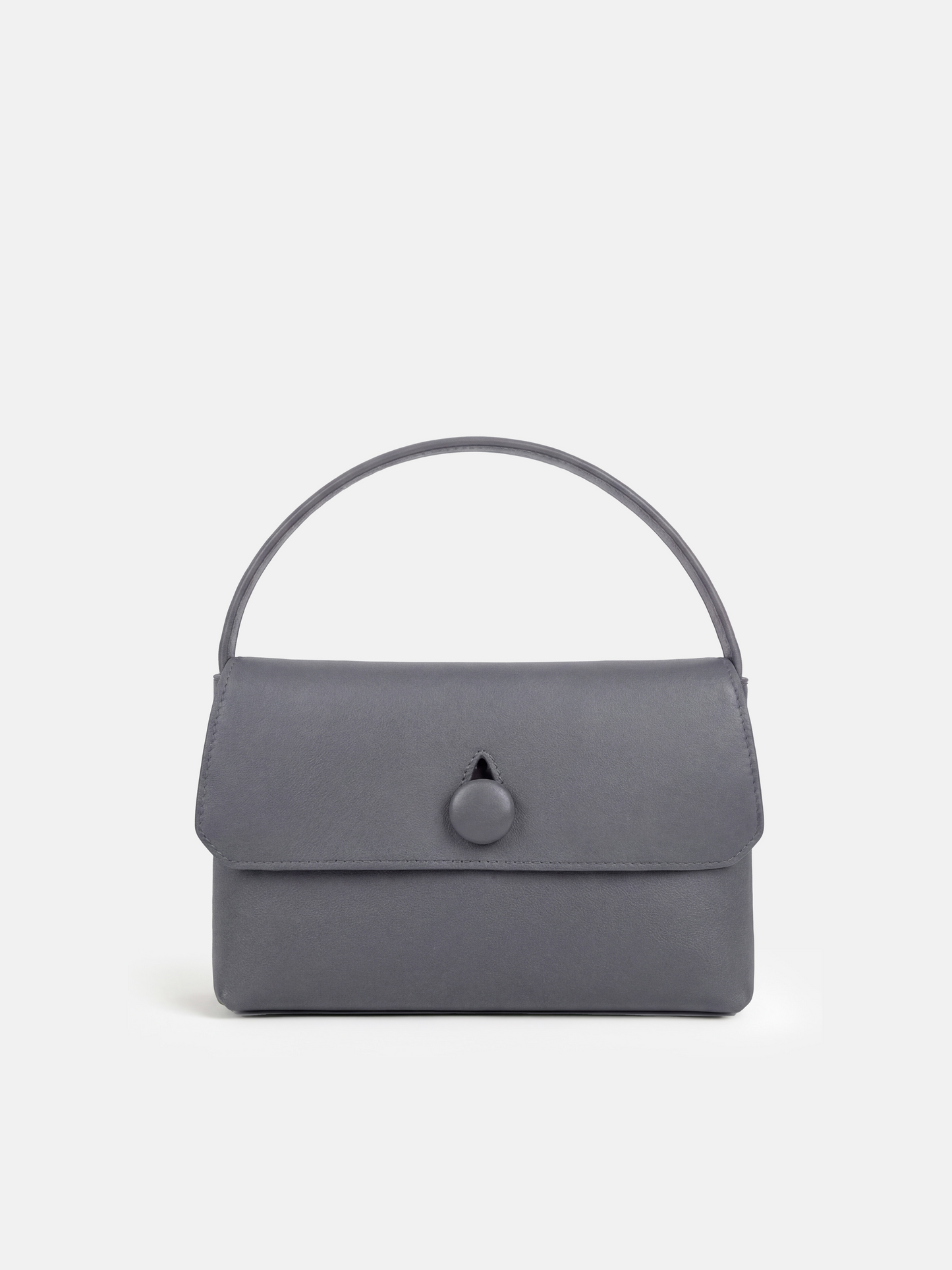 SELVANE Saddle Leather Top-Handle Flap Bag, featuring clean geometry, structured volume, and a precise flap closure.