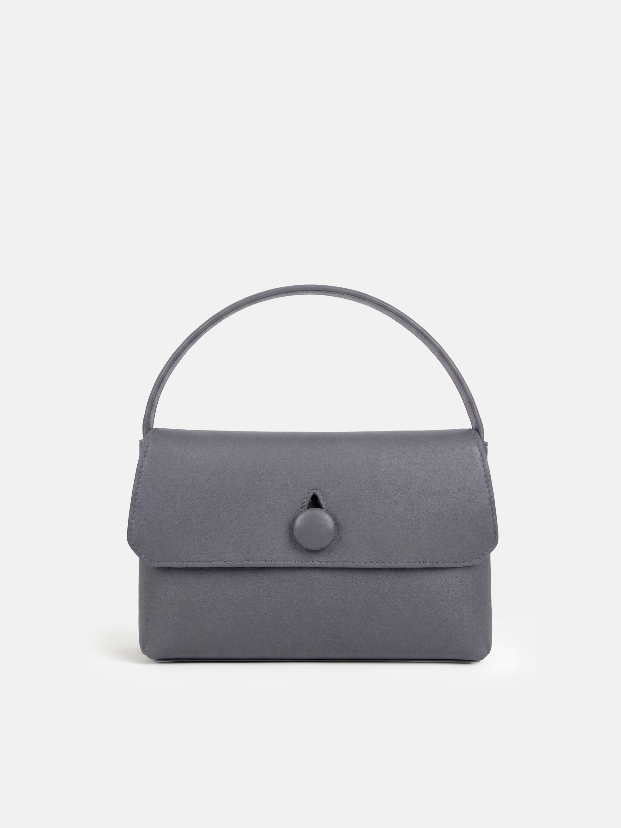 SELVANE Saddle Leather Top-Handle Flap Bag, featuring clean geometry, structured volume, and a precise flap closure.
