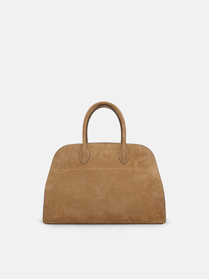 SELVANE Arched Suede Top-Handle Bag, featuring a domed silhouette and velvet-touch surface, presented on a minimalist background.