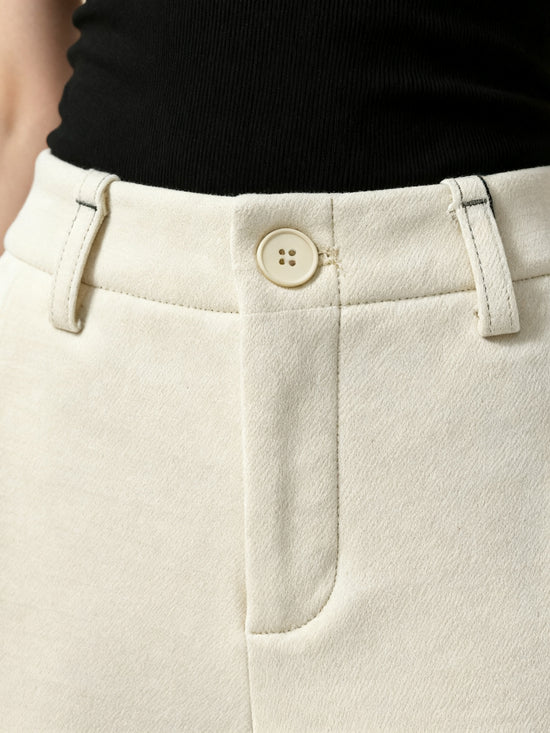 SELVANE Crease-Front Wide-Leg Trousers in a deep hue, showcasing crisp front creases and controlled volume, worn by a model in motion.