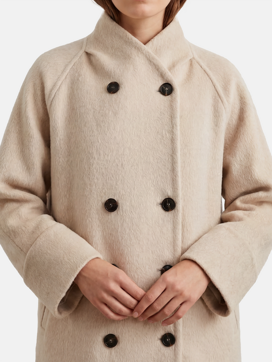 SELVANE double-breasted camel hair coat with raglan sleeves, oversized fit, above-knee length, warm ivory tone.