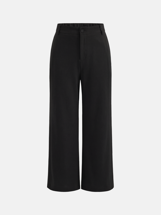 SELVANE Crease-Front Wide-Leg Trousers in a deep hue, showcasing crisp front creases and controlled volume, worn by a model in motion.
