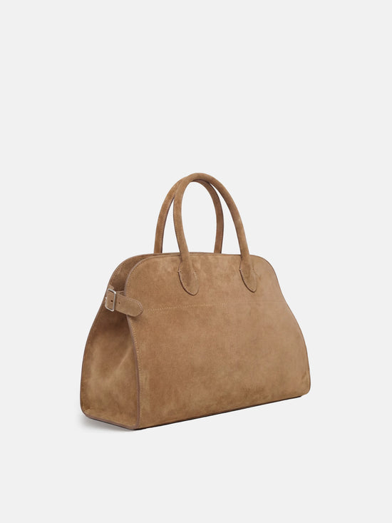 SELVANE Arched Suede Top-Handle Bag, featuring a domed silhouette and velvet-touch surface, presented on a minimalist background.