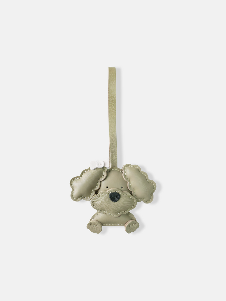 Selvane Bow Poodle bag charm in minimalist leather, featuring a sculpted poodle figure with a small, precise bow.