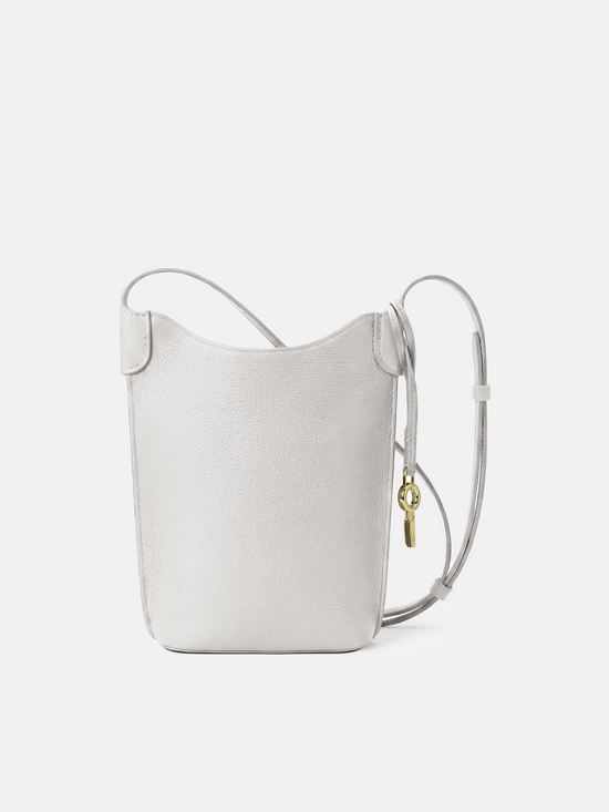 SELVANE Leather Mini Bucket Bag in Bonaudo cow leather, featuring soft vertical lines, a curved top, and long strap, sitting neatly.
