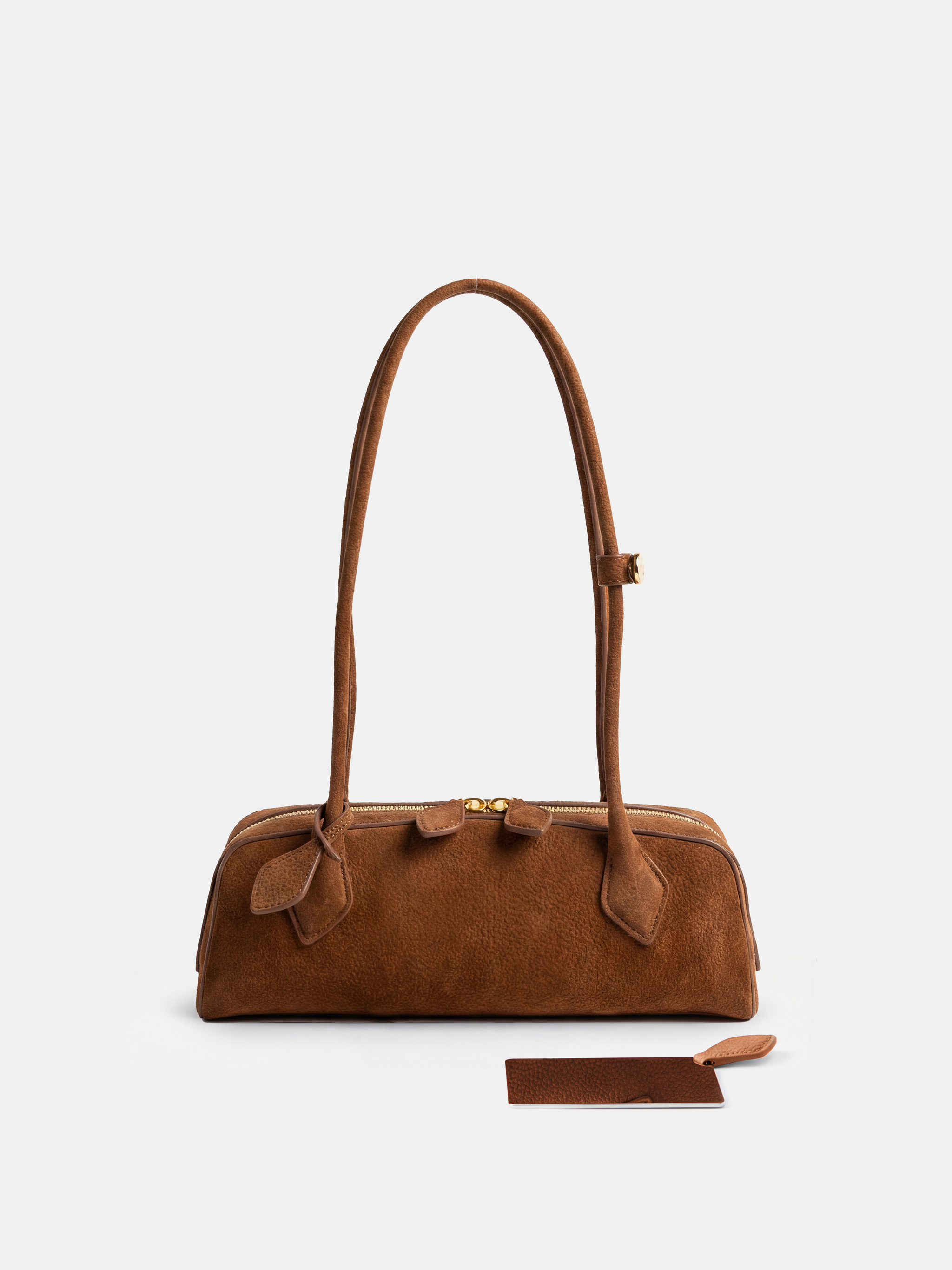 SELVANE Sausage Zipper Shoulder Bag in custom leather, longline, low-profile, softly rounded, with a streamlined zipper top.