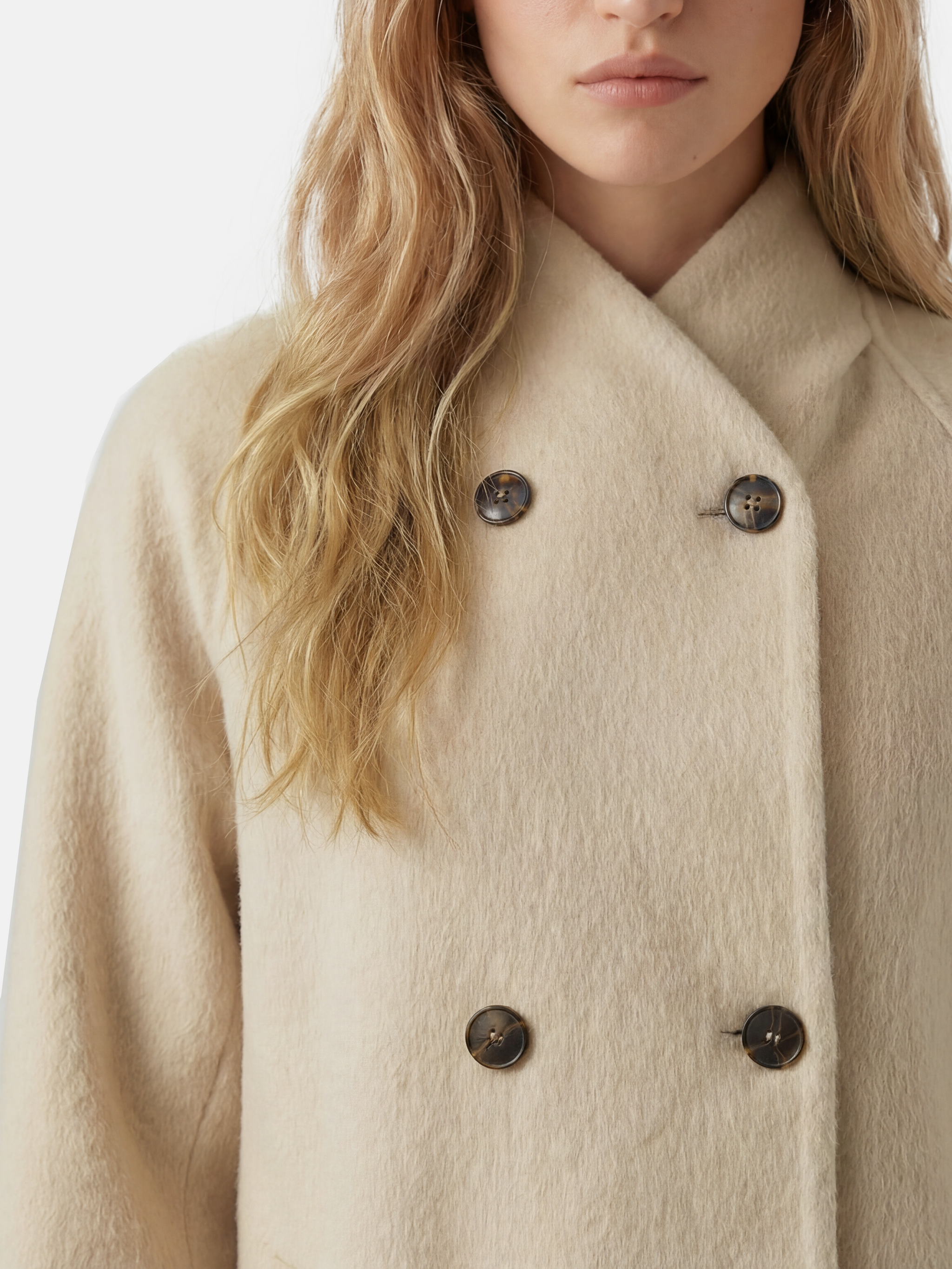 SELVANE double-breasted camel hair coat with raglan sleeves, oversized fit, above-knee length, warm ivory tone.