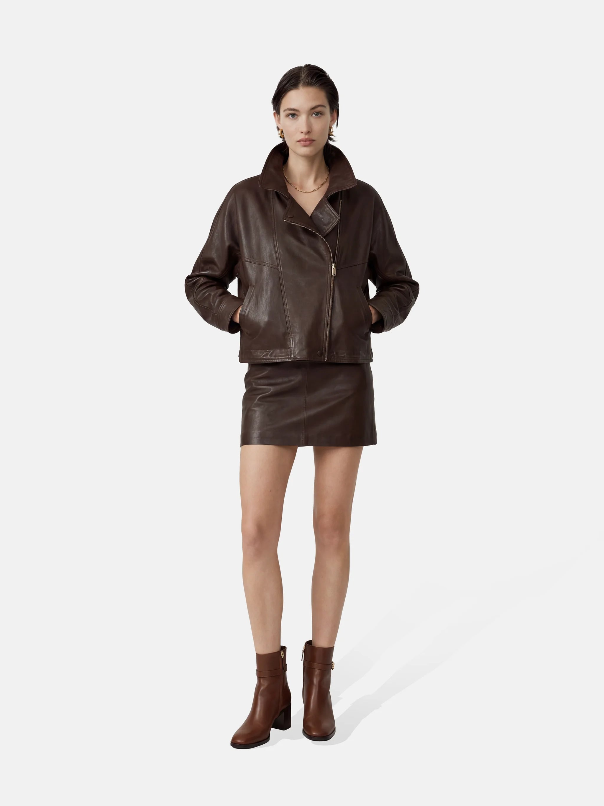 SELVANE Asymmetric Zip-Collar Lambskin Jacket in coffee-toned leather, showcasing its structural lines and urban elegance.