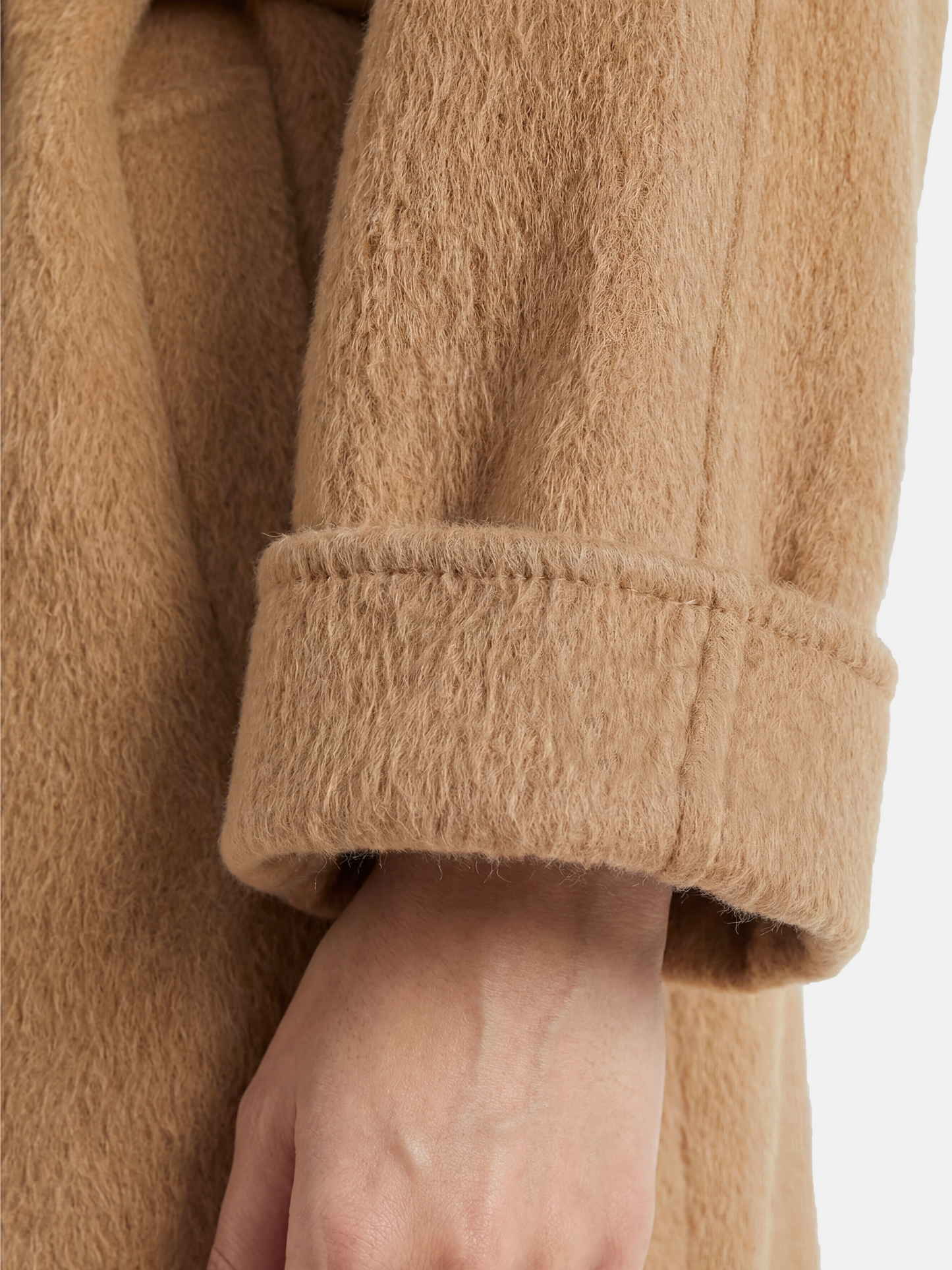 Full-length SELVANE camelhair belted coat with raglan sleeves and high stand collar, showcasing its elongated silhouette and plush texture.