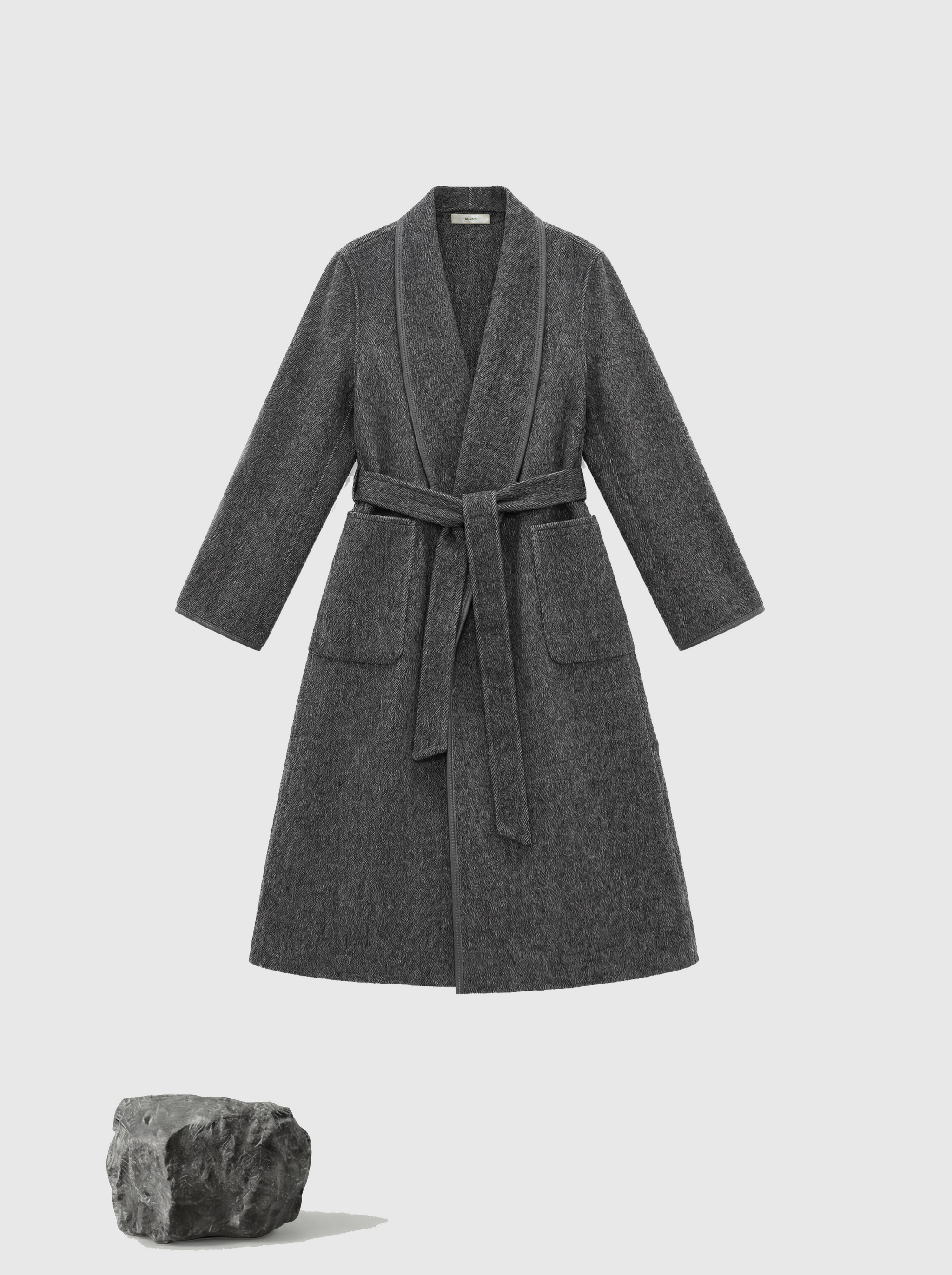 SELVANE Belted Wool Long Coat in a soft wool-llama blend, featuring a fluid drape and clean topstitched edges, worn by a model in a composed stance.