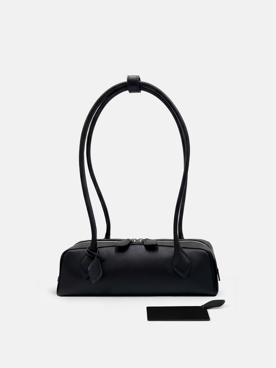 SELVANE Sausage Zipper Shoulder Bag in custom leather, longline, low-profile, softly rounded, with a streamlined zipper top.