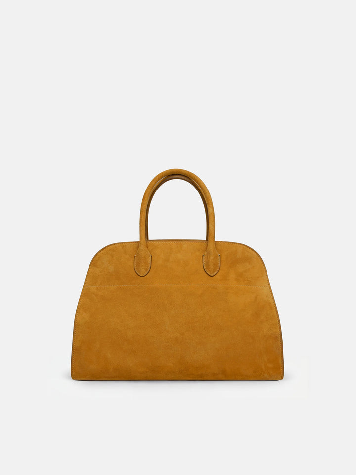SELVANE Arched Suede Top-Handle Bag, featuring a domed silhouette and velvet-touch surface, presented on a minimalist background.