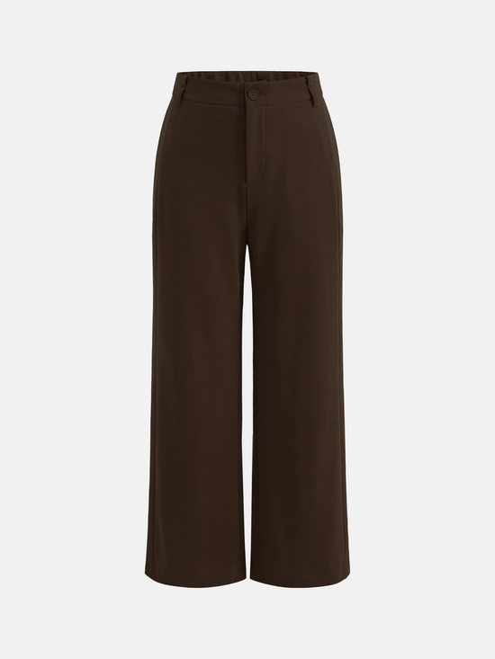 SELVANE Crease-Front Wide-Leg Trousers in a deep hue, showcasing crisp front creases and controlled volume, worn by a model in motion.