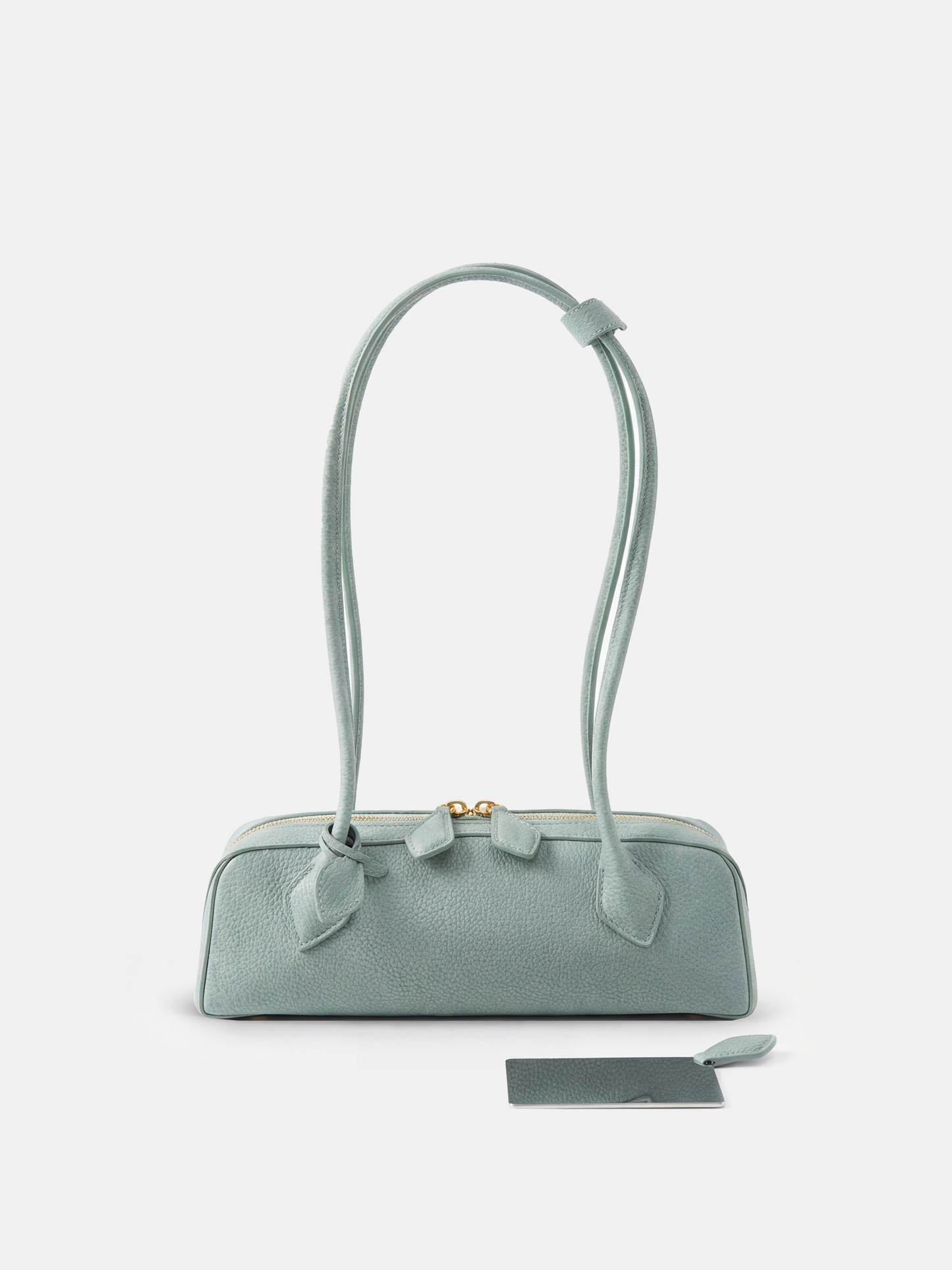 SELVANE Sausage Zipper Shoulder Bag in custom leather, longline, low-profile, softly rounded, with a streamlined zipper top.