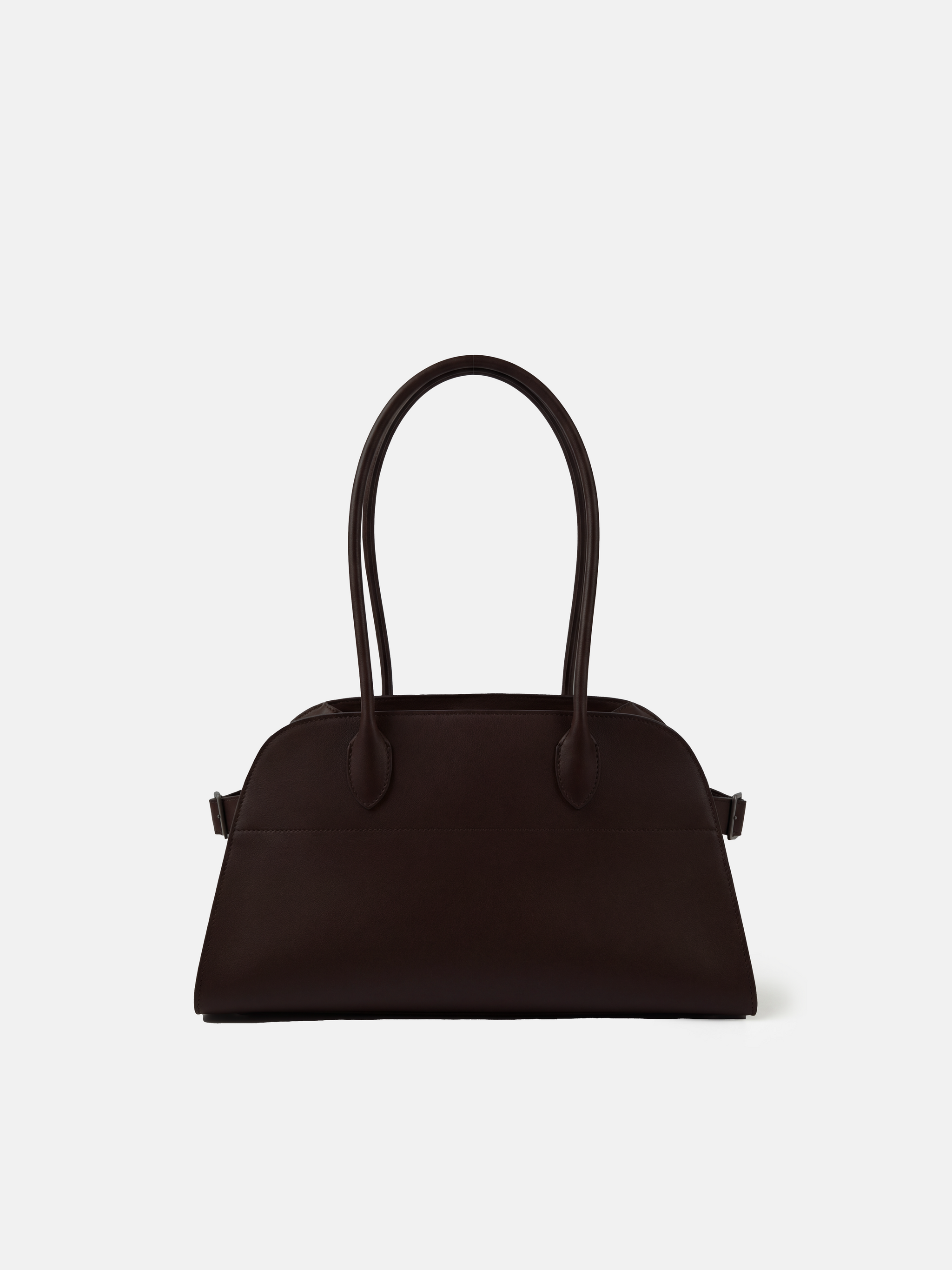 Structured deep navy saddle leather top handle bag with clean curves and elegant trapezoid shape.