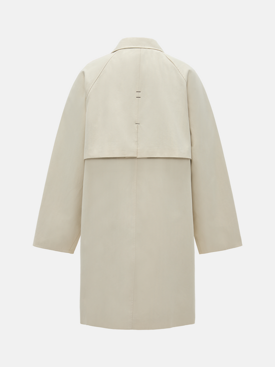 SELVANE light khaki straight-line trench coat with distinctive striped turn-up cuffs, showcasing controlled volume and fluid drape.