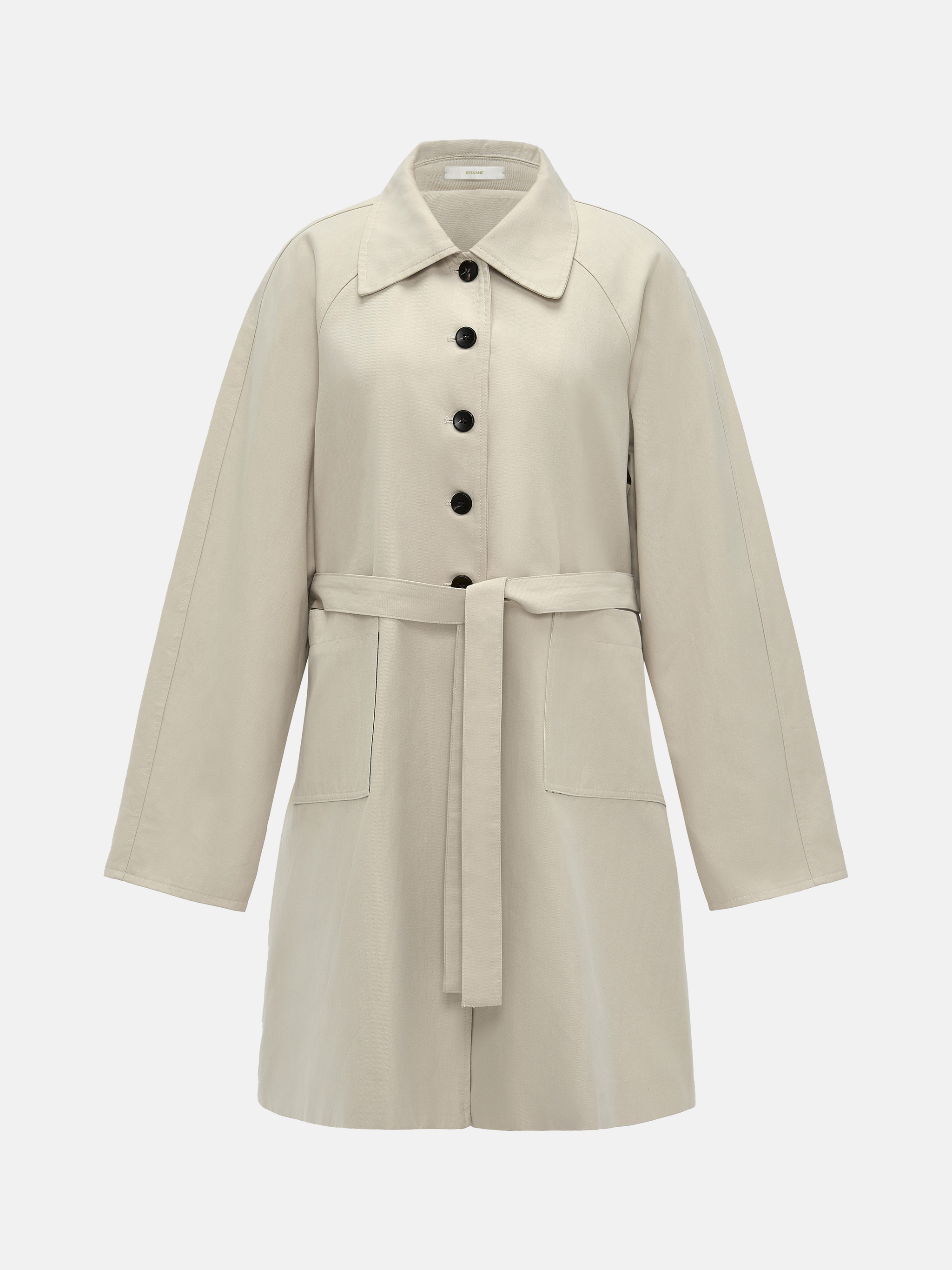 SELVANE light khaki straight-line trench coat with distinctive striped turn-up cuffs, showcasing controlled volume and fluid drape.