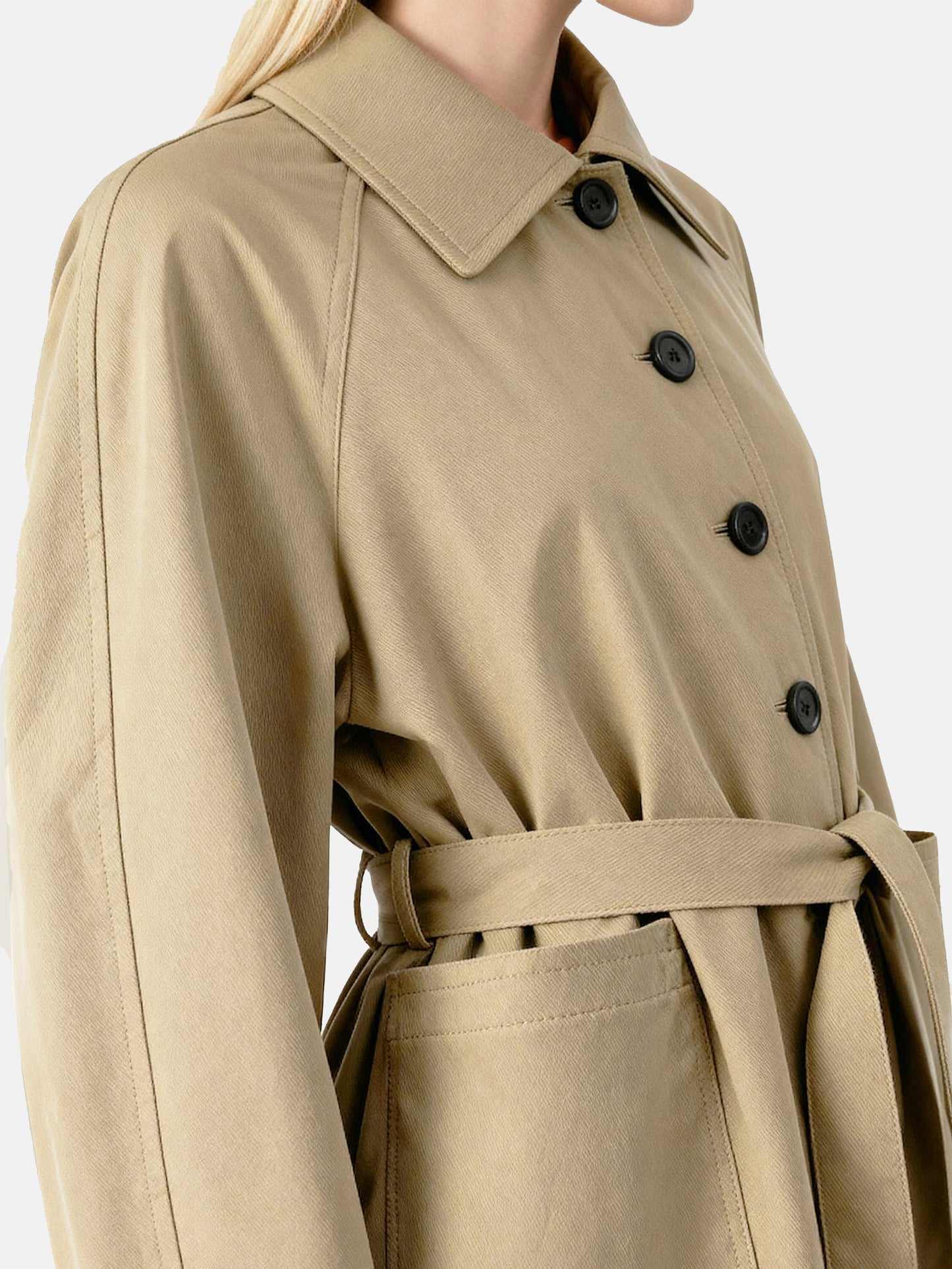 SELVANE light khaki straight-line trench coat with distinctive striped turn-up cuffs, showcasing controlled volume and fluid drape.