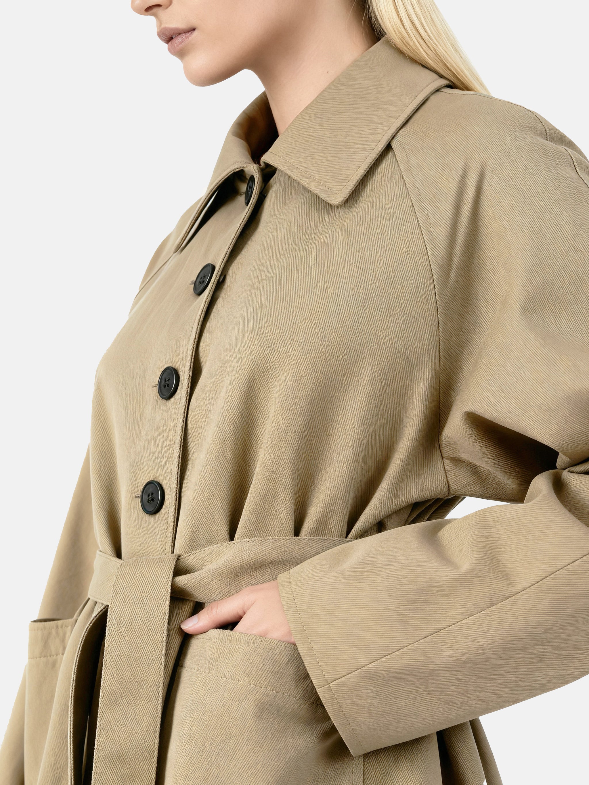 SELVANE light khaki straight-line trench coat with distinctive striped turn-up cuffs, showcasing controlled volume and fluid drape.