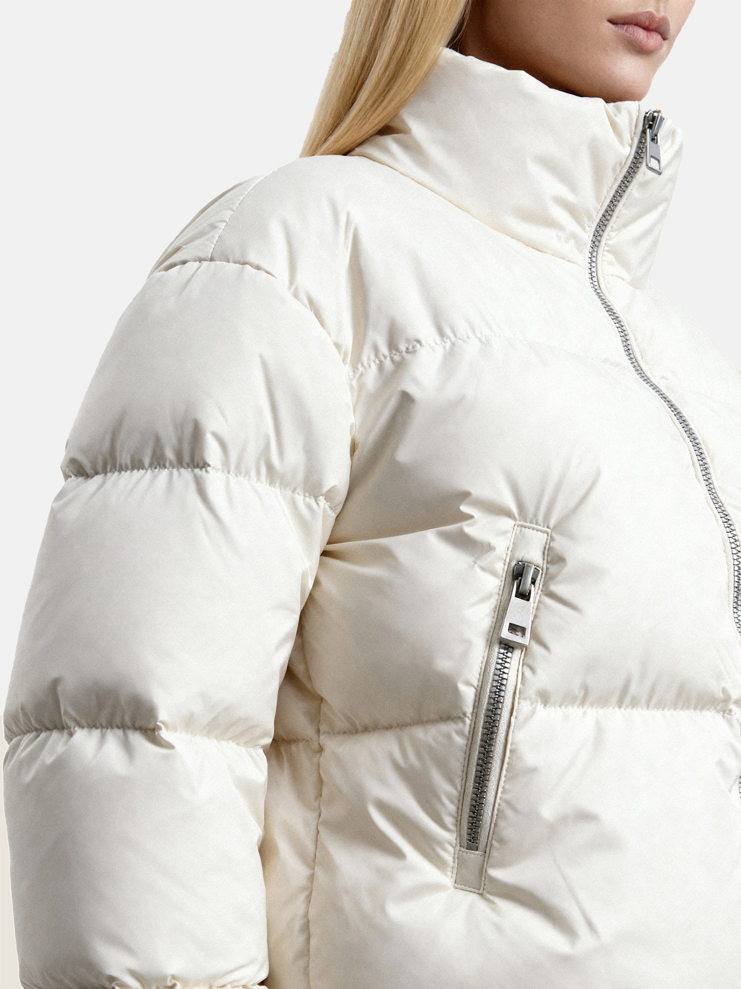 SELVANE Minimal Padded Down Jacket, cropped with a subtle stand collar, crisp panel quilting, and a soft matte finish, embodying sculptural volume.