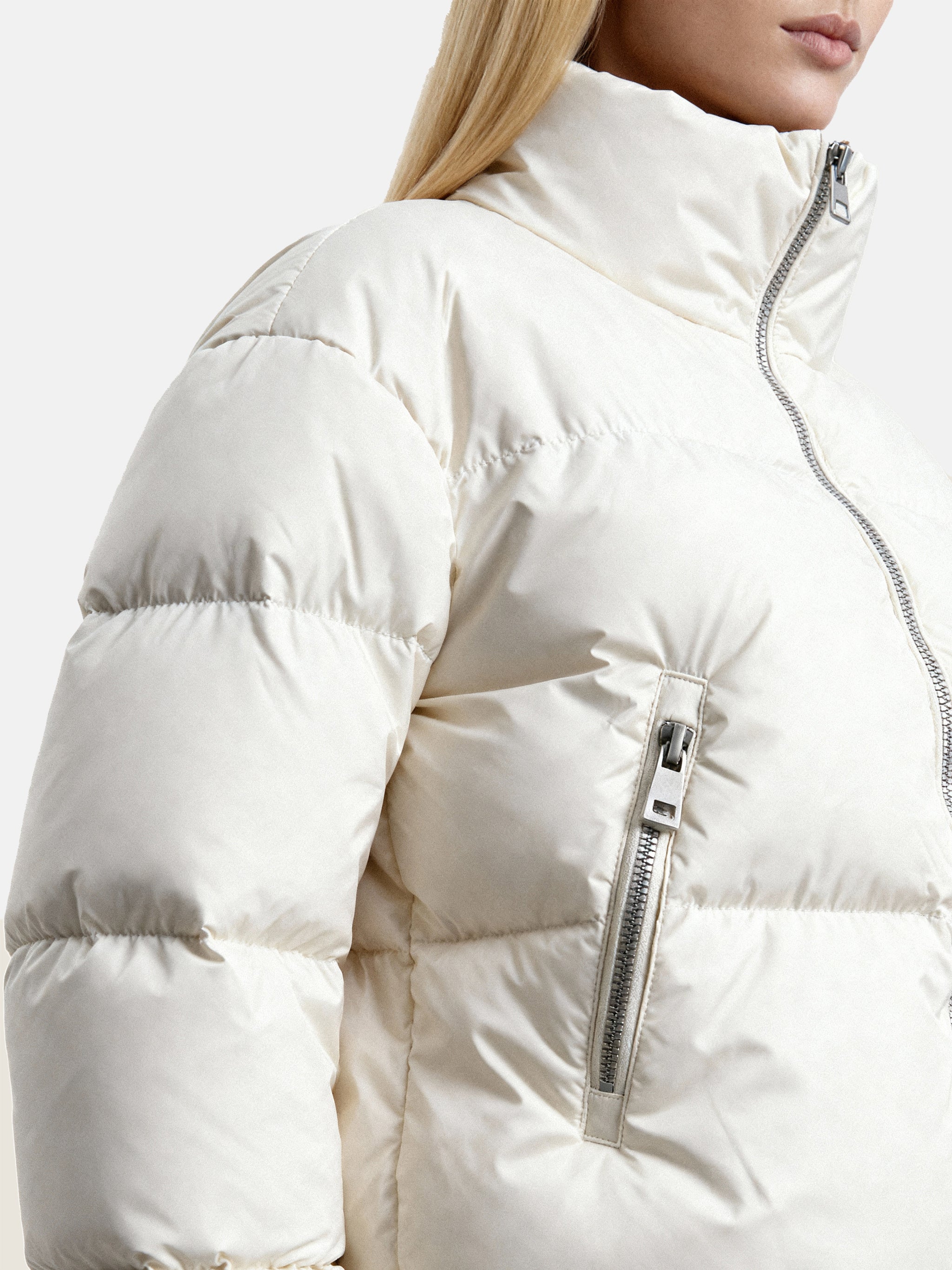 SELVANE Minimal Padded Down Jacket, cropped with a subtle stand collar, crisp panel quilting, and a soft matte finish, embodying sculptural volume.
