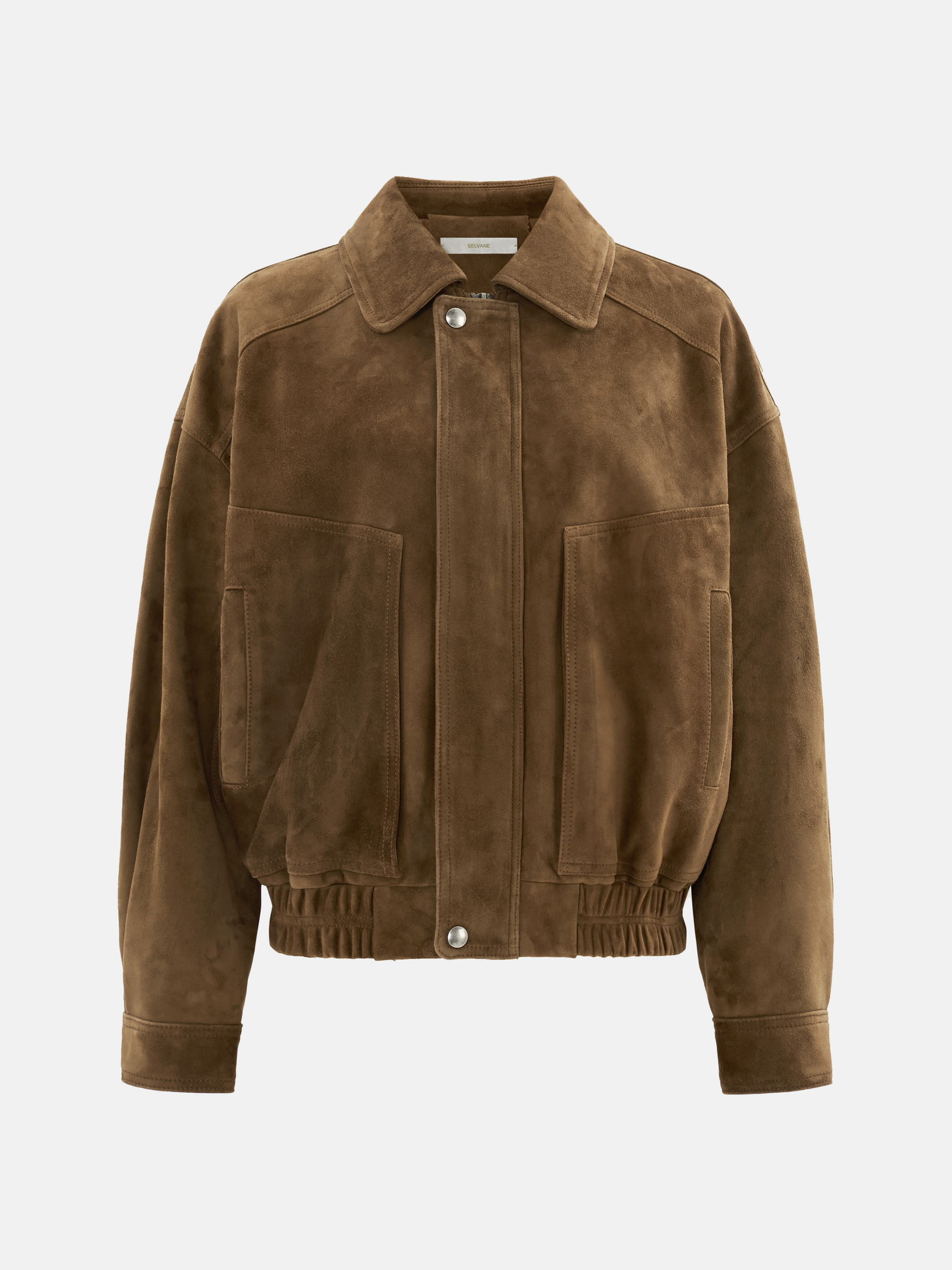 Oversized tan lambskin jacket by SELVANE, featuring a wide pointed collar, ribbed cuffs, and relaxed volume.