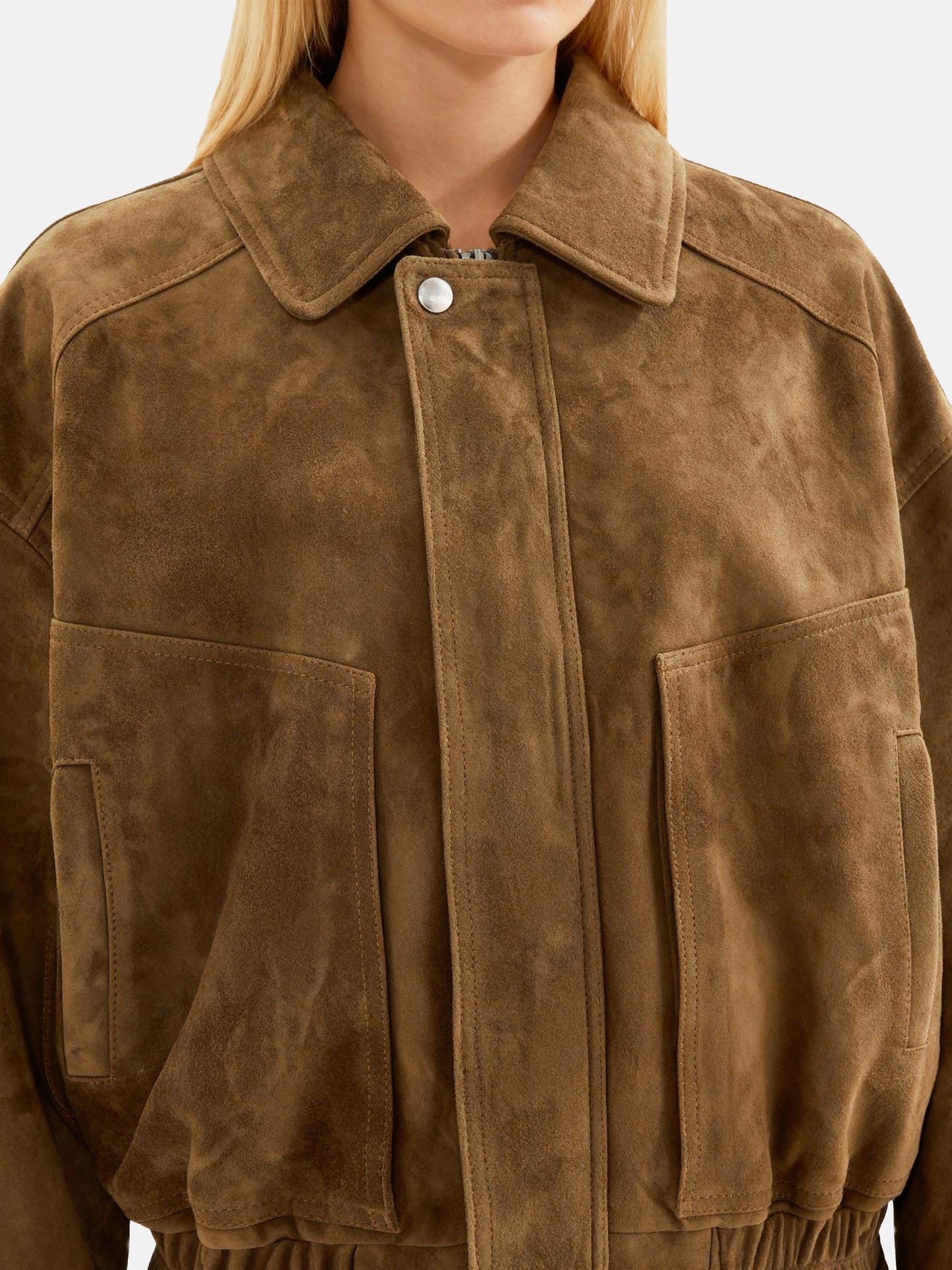 Oversized tan lambskin jacket by SELVANE, featuring a wide pointed collar, ribbed cuffs, and relaxed volume.
