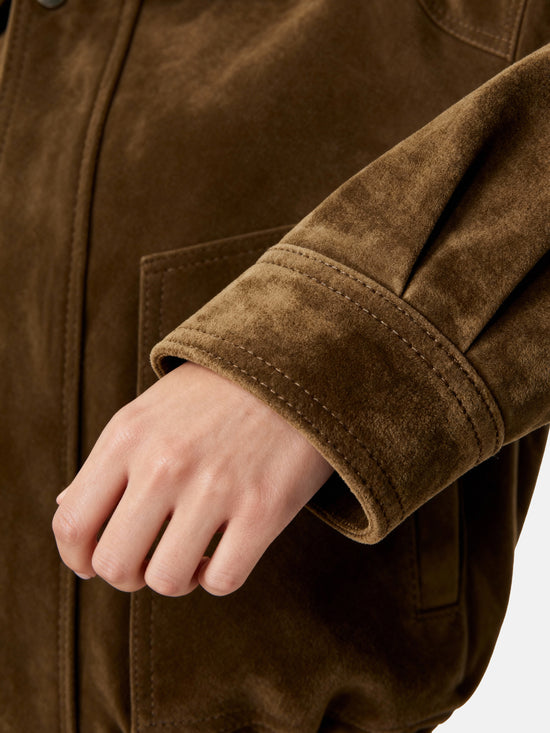 Oversized tan lambskin jacket by SELVANE, featuring a wide pointed collar, ribbed cuffs, and relaxed volume.