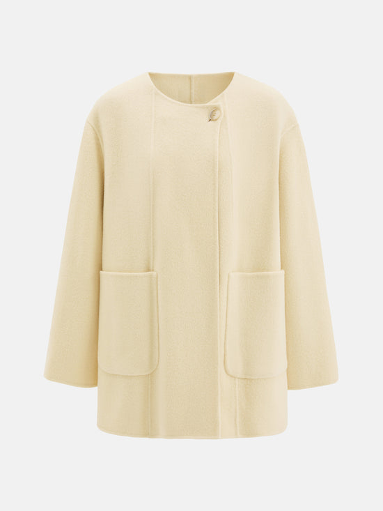 SELVANE Structured Wool Wrap Coat in a neutral tone, featuring a built-in scarf neckline and clean lines, draped elegantly on a figure.