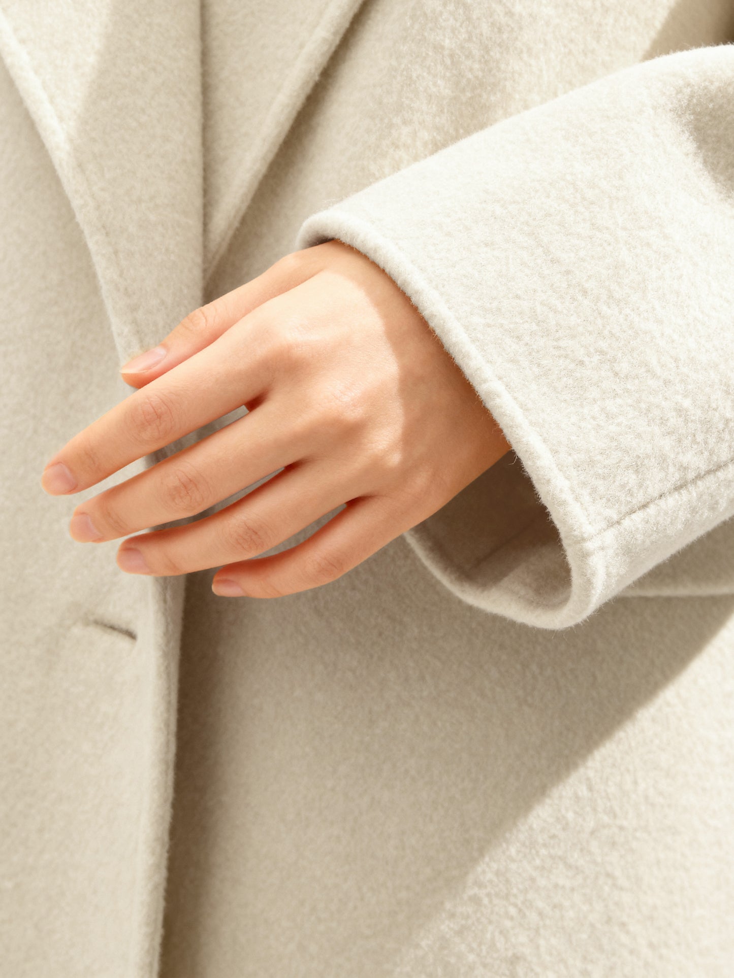 SELVANE Structured Wool Wrap Coat in a neutral tone, featuring a built-in scarf neckline and clean lines, draped elegantly on a figure.