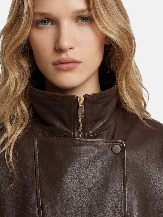 SELVANE Asymmetric Zip-Collar Lambskin Jacket in coffee-toned leather, showcasing its structural lines and urban elegance.