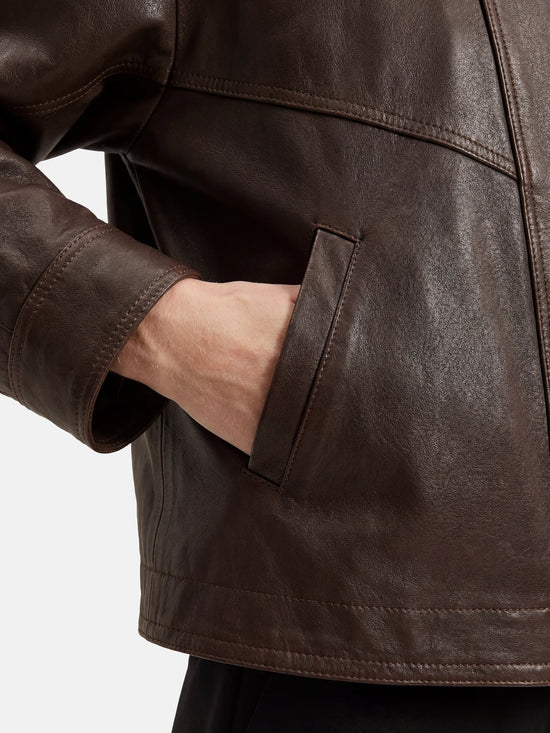SELVANE Asymmetric Zip-Collar Lambskin Jacket in coffee-toned leather, showcasing its structural lines and urban elegance.