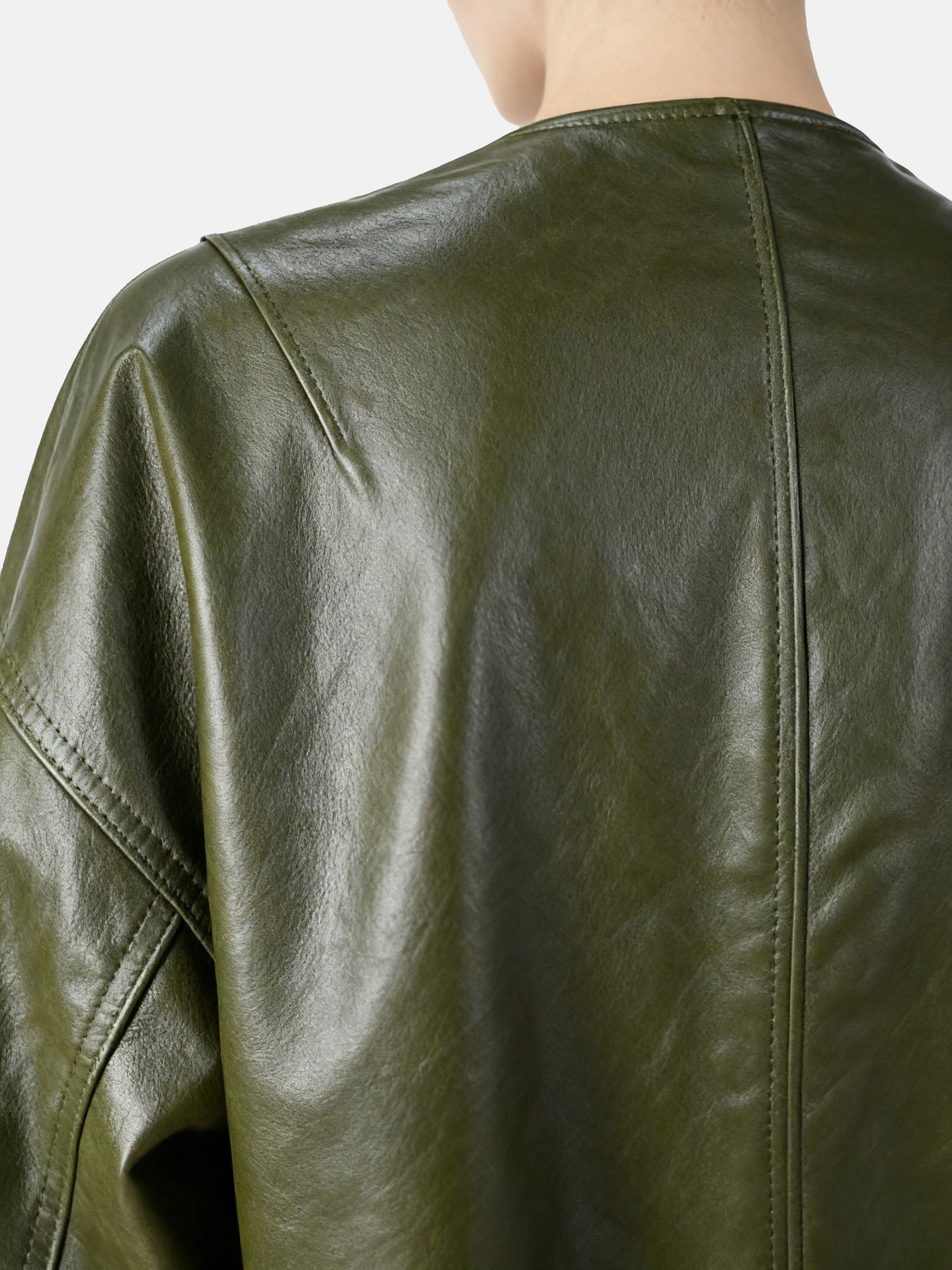 Cropped olive lambskin jacket with a clean round neckline and tonal buttons, showcasing a precise, composed silhouette.