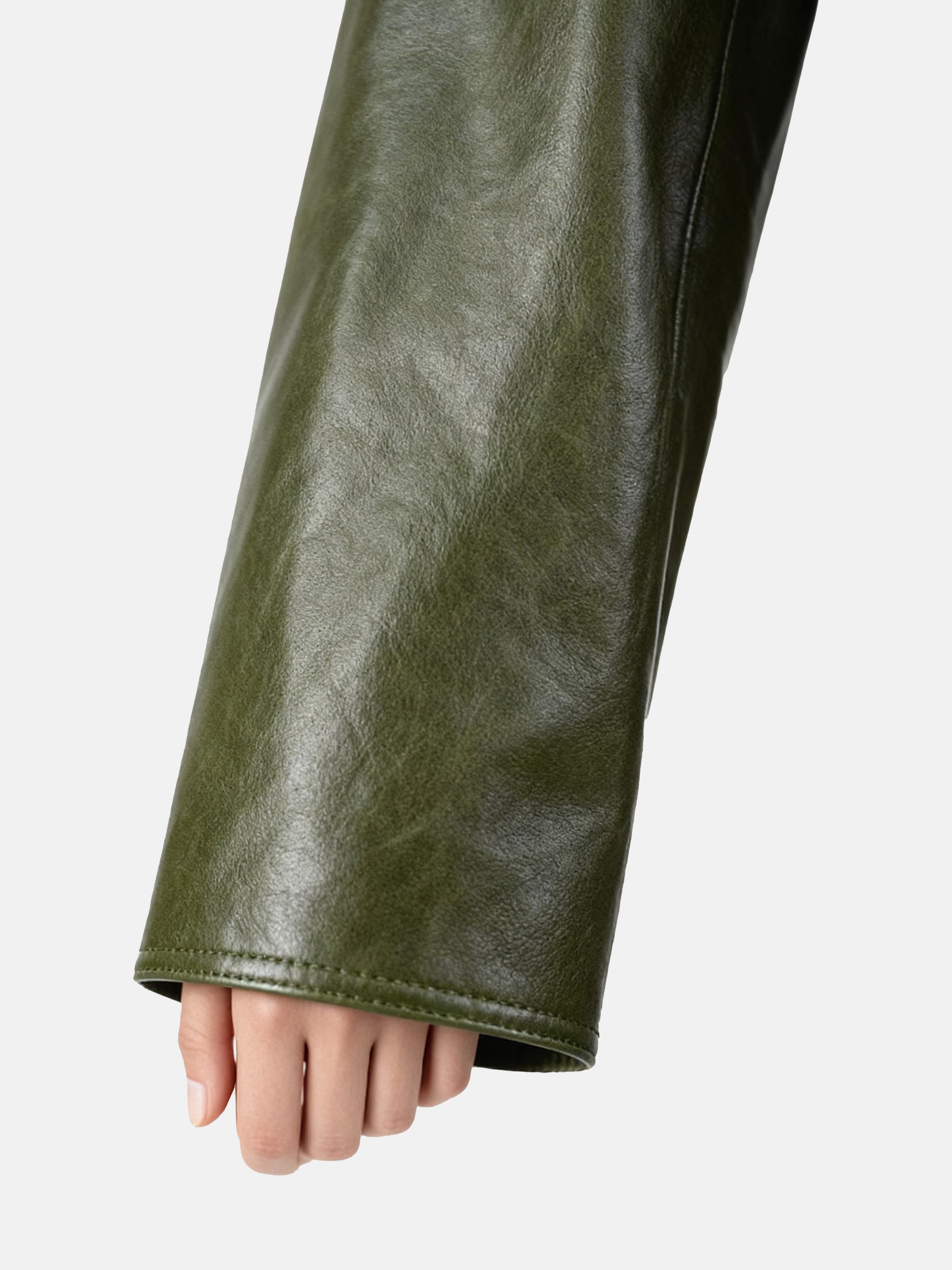 Cropped olive lambskin jacket with a clean round neckline and tonal buttons, showcasing a precise, composed silhouette.