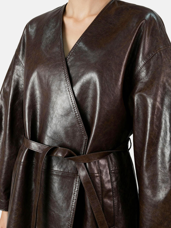 Sleek rich brown lambskin wrap belt jacket, defining the waist with a quiet gesture, clean column silhouette.