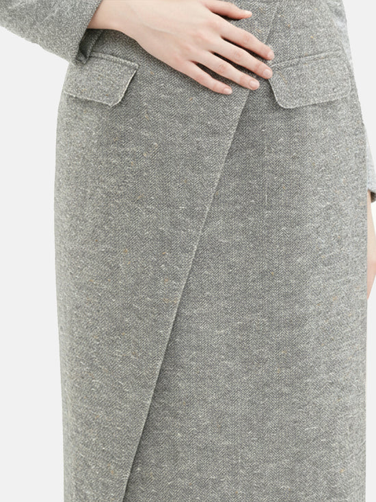 Cropped blazer and wrap midi skirt set in grey, featuring disciplined shoulders and fluid lines, inspired by volcanic terrain.