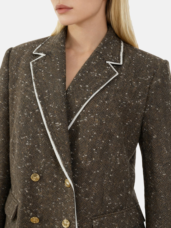 Structured coffee mélange blazer with sharp lapels, ivory piping, and gold buttons, embodying refined British tailoring.