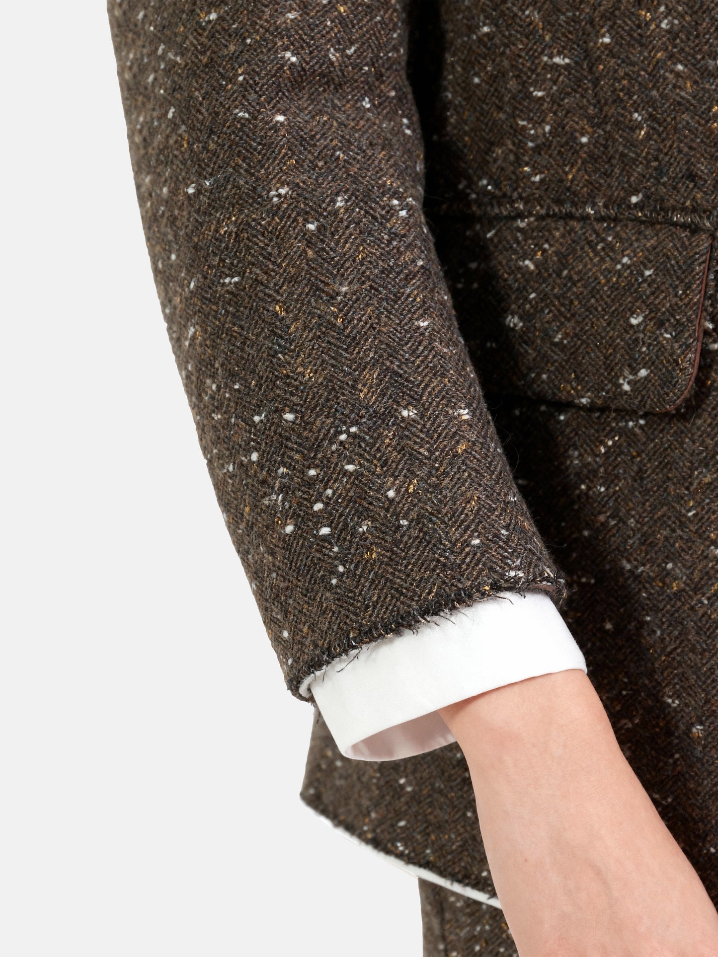 Structured coffee mélange blazer with sharp lapels, ivory piping, and gold buttons, embodying refined British tailoring.