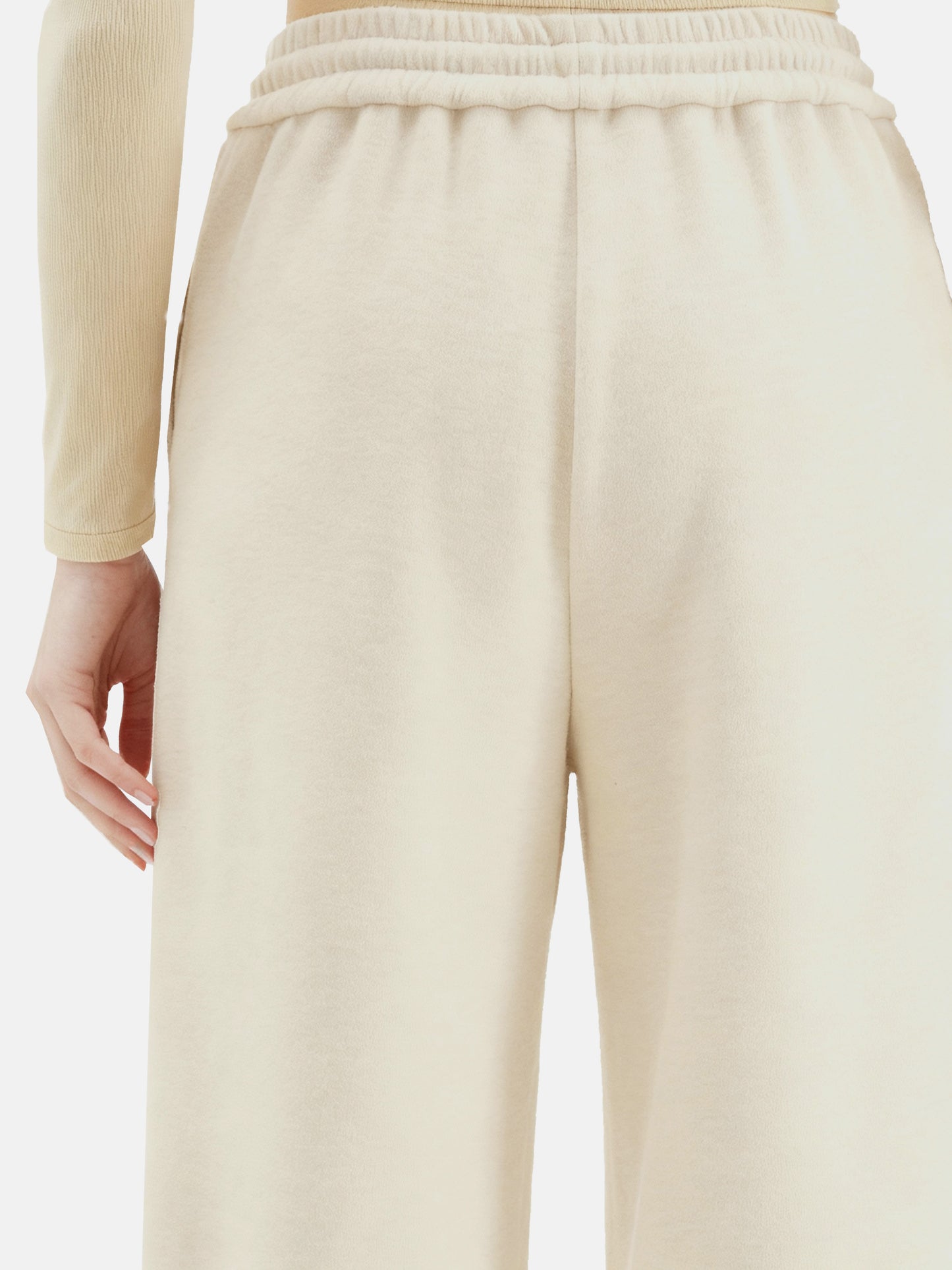 Off-white SELVANE Collared Knit Pullover and Wide-Leg Pants Set, featuring a V-neck and fluid silhouette.