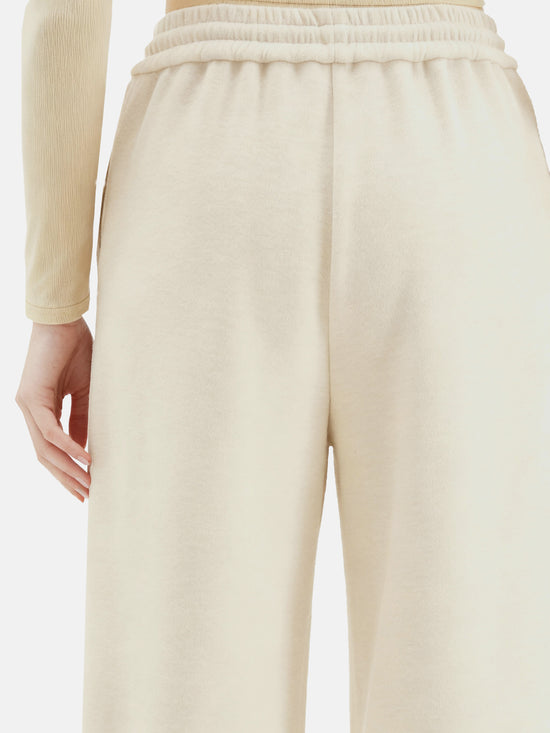 Off-white SELVANE Collared Knit Pullover and Wide-Leg Pants Set, featuring a V-neck and fluid silhouette.