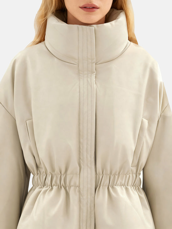 Apricot high-collar structured puffer down jacket by SELVANE, featuring a concealed placket and cinched waist, presented architecturally.