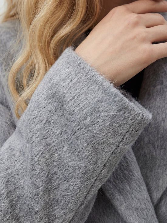 SELVANE Soft-Texture Double-Breasted Coat in a rich, brushed wool-cashmere blend, featuring a clean notch lapel and relaxed volume.