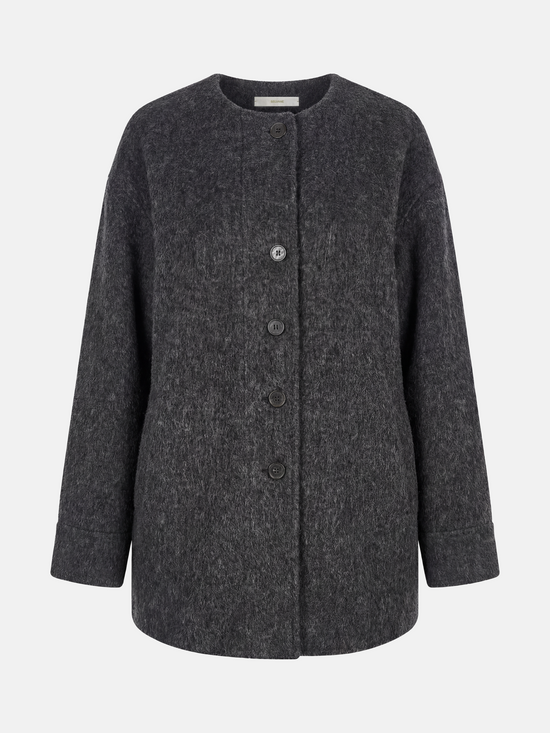 Beige wool and camel hair buttoned coat by SELVANE, featuring a rounded neck and minimal buttons, draped elegantly.