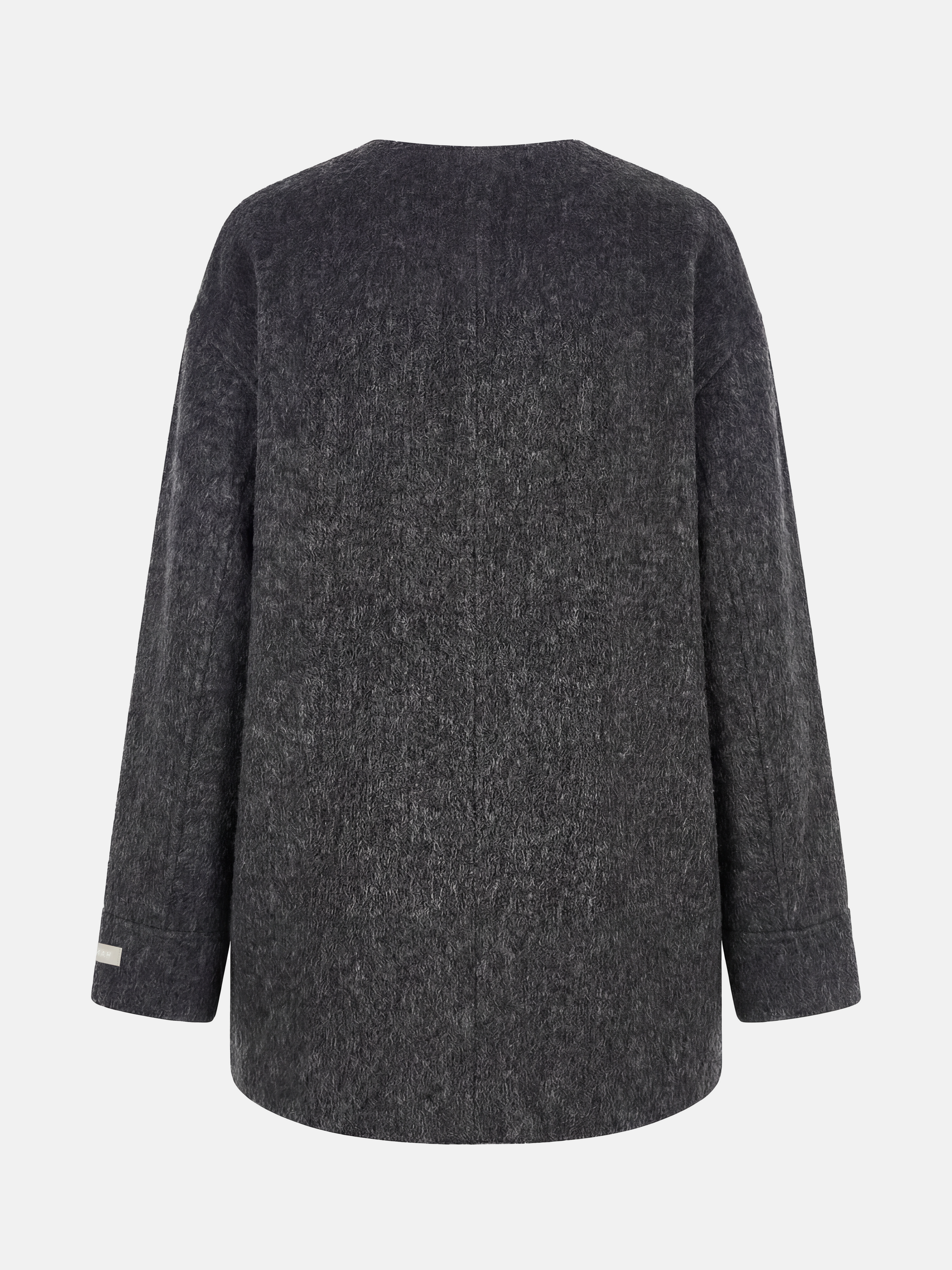 Beige wool and camel hair buttoned coat by SELVANE, featuring a rounded neck and minimal buttons, draped elegantly.