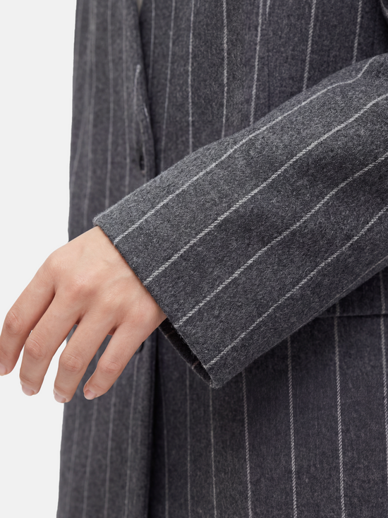 SELVANE Pinstripe Wool Scarf-Collar Blazer, featuring sharp vertical lines and an integrated wrap-neck for a composed, refined silhouette.