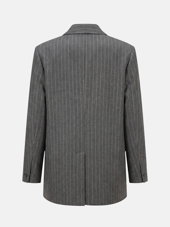 SELVANE Pinstripe Wool Blazer, longline with softened peak lapel and single-button front, tailored for a calm, vertical silhouette.