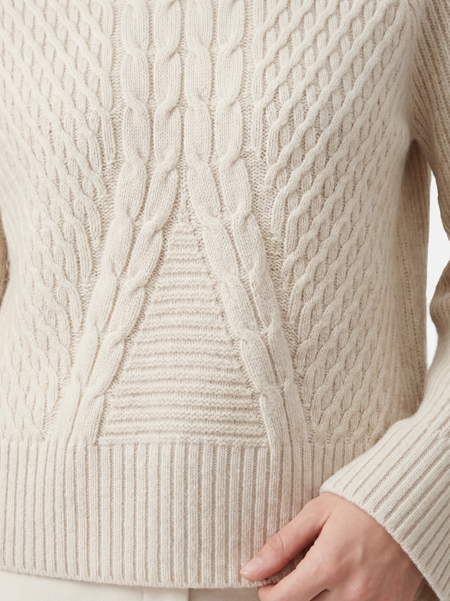 SELVANE Cable Cashmere Turtleneck Sweater in a natural hue, showcasing its refined centered cable panel, structured neckline, and relaxed fit.