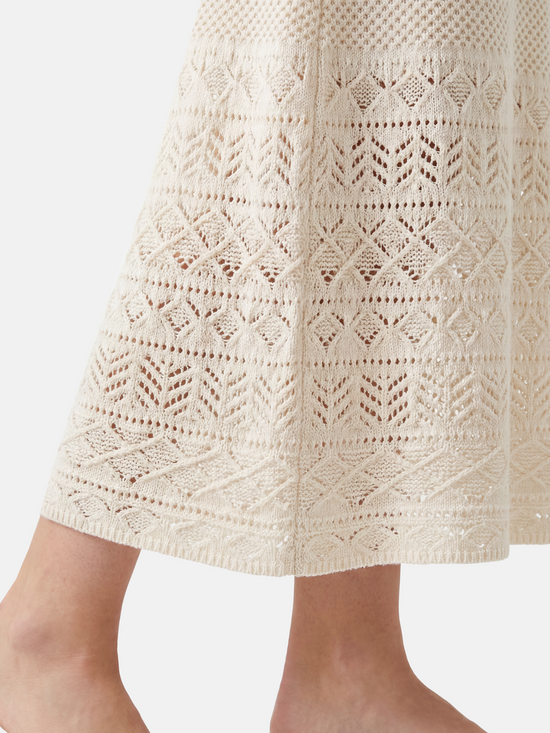 SELVANE Cashmere Open-Knit Sleeveless Maxi Dress in a natural setting, showcasing its elongated fall and airy texture.
