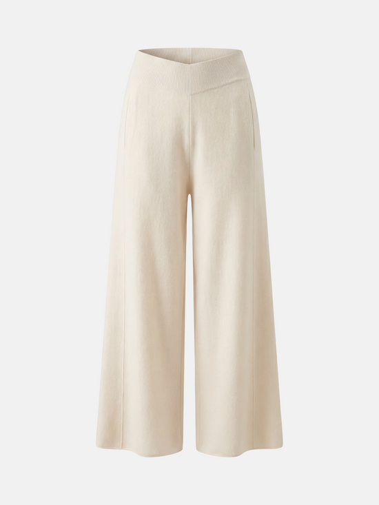Ivory cashmere wide-leg pants by SELVANE, featuring a soft V-shaped rib waistband and elegant vertical drape.