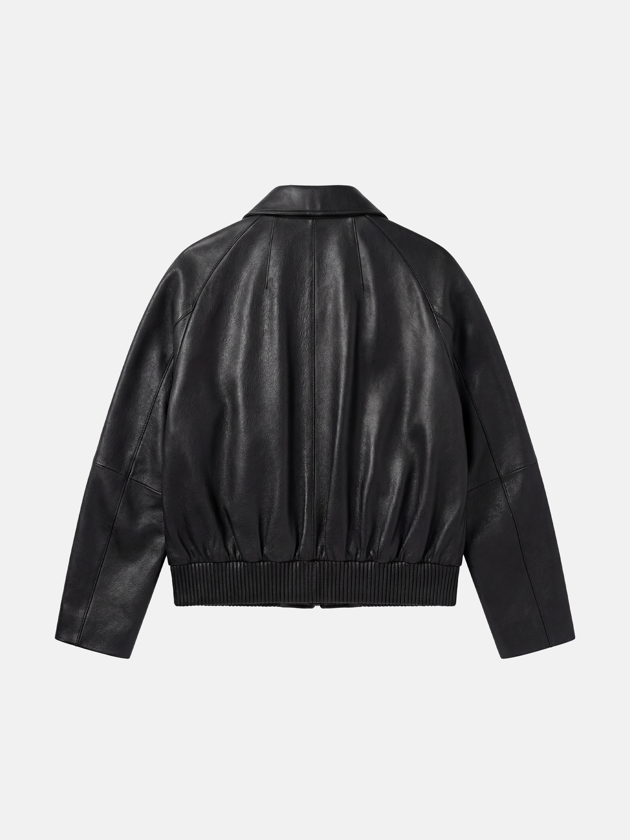 SELVANE deep black lambskin button bomber, cropped silhouette with ribbed hem and oversized patch pockets.
